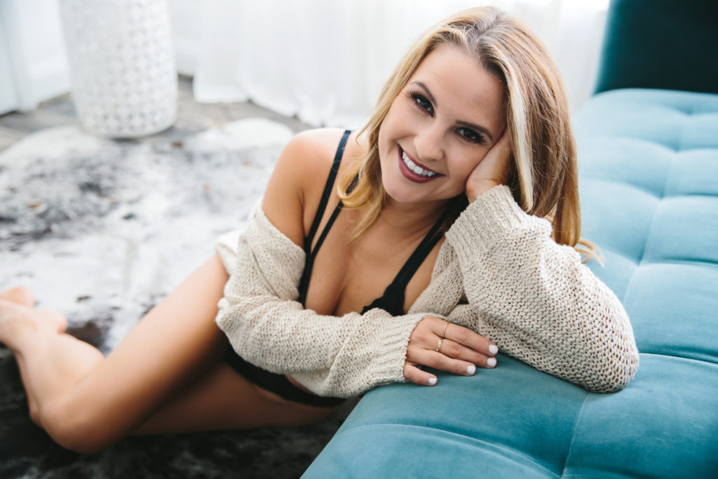 boudoir photo, woman in black bra and white sweater