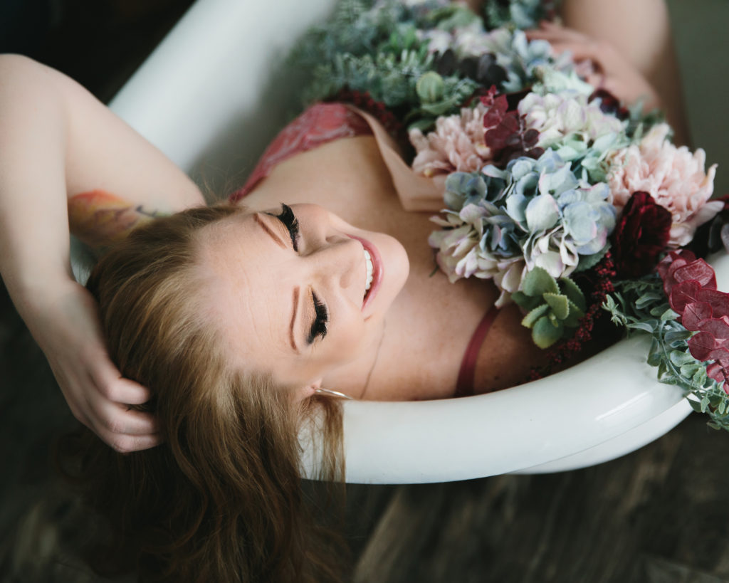 Boudoir Portrait, brunette in bathtub with flowers; Lindsay Hite