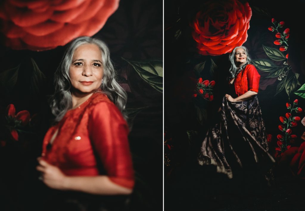 Woman in black dress and red jacket with red floral background, what do I wear, photography by Lindsay Hite