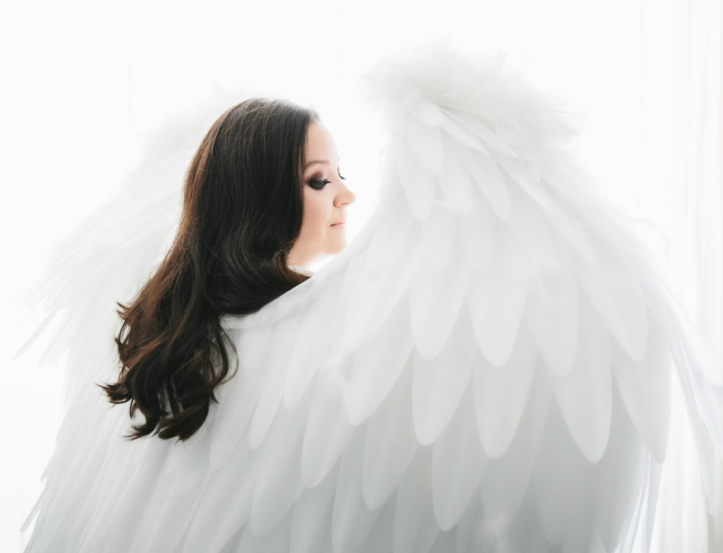Woman in angel wings, boudoir photography by Lindsay Hite