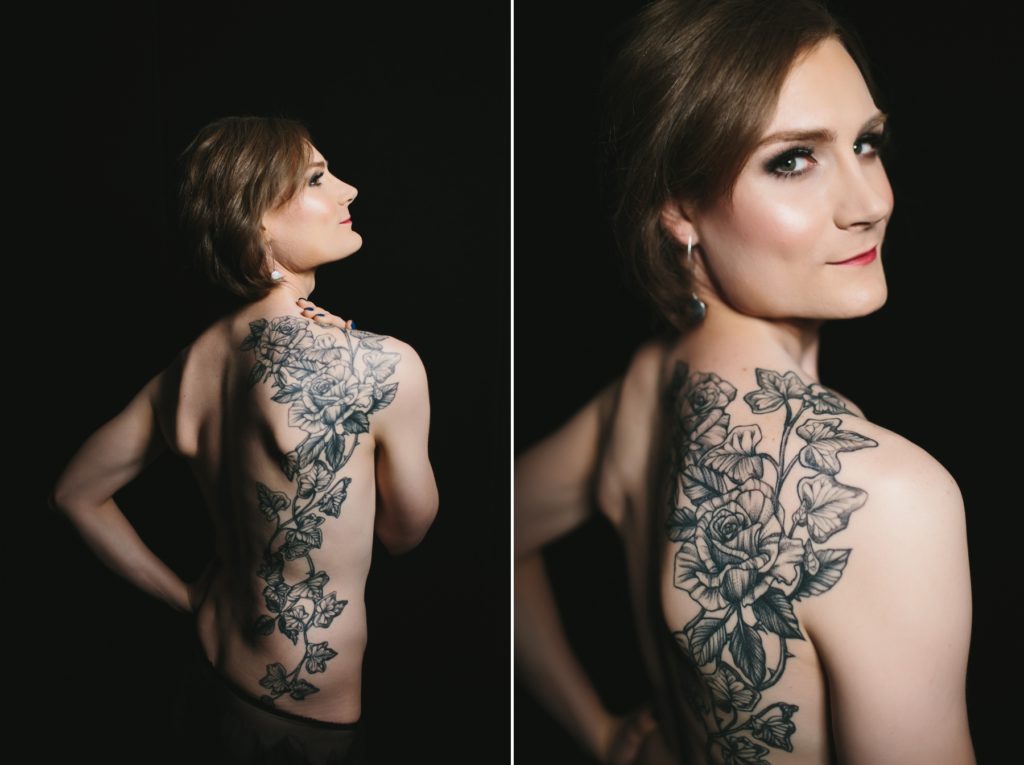 blonde woman topless showing off tattoo in front of a dark background; boudoir photography by Lindsay Hite