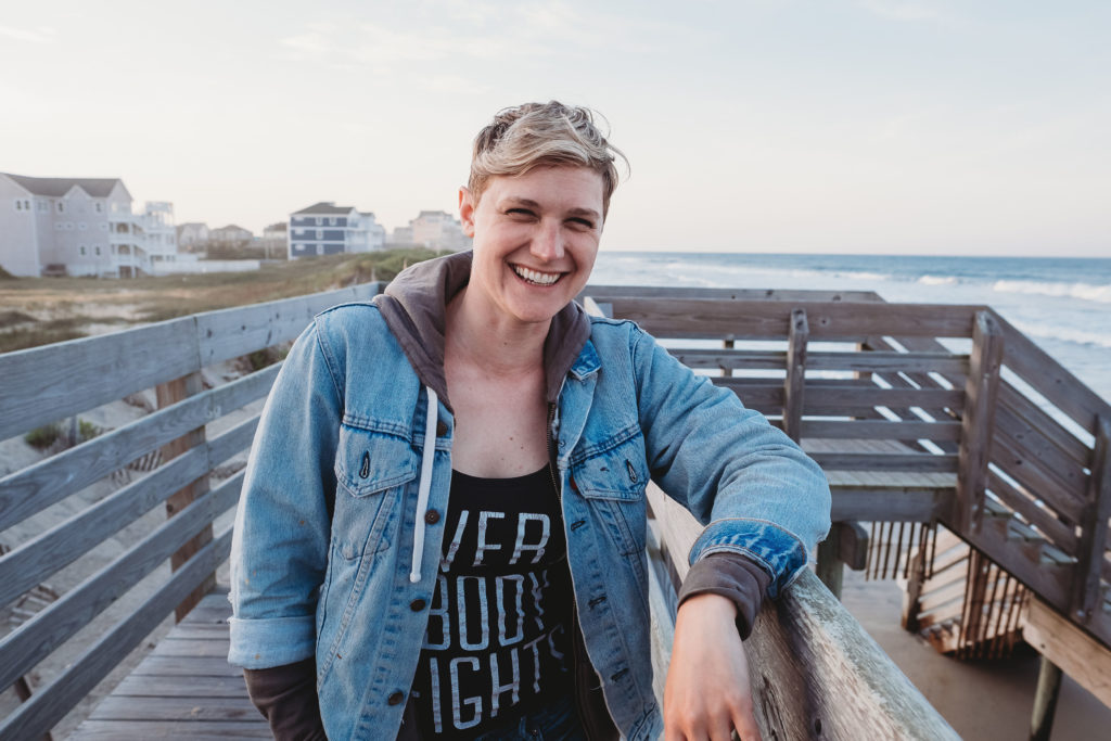 Image of Lindsay Hite with beach background; how to overcome imposter syndrome