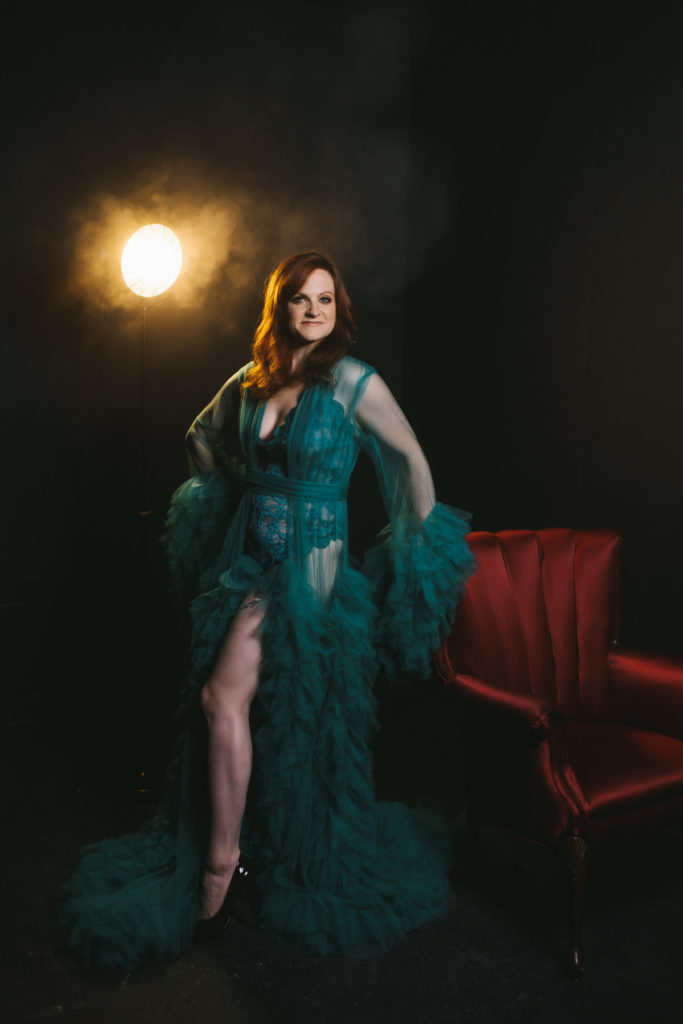 Woman in Teal Hollywood Robe with black backdrop; by Lindsay Hite