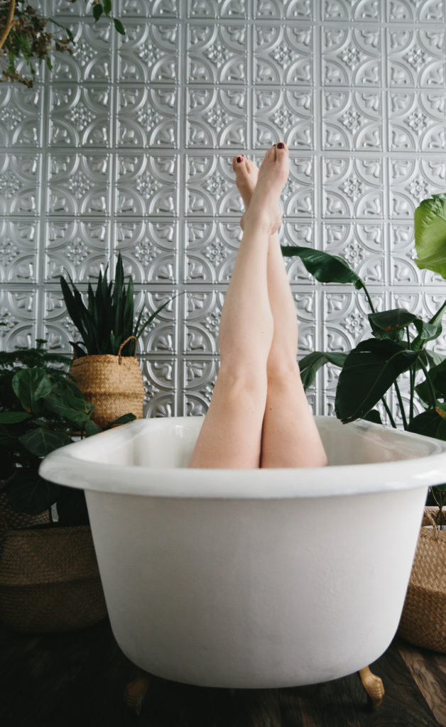 Woman's legs in a Garden Tub by Lindsay HIte