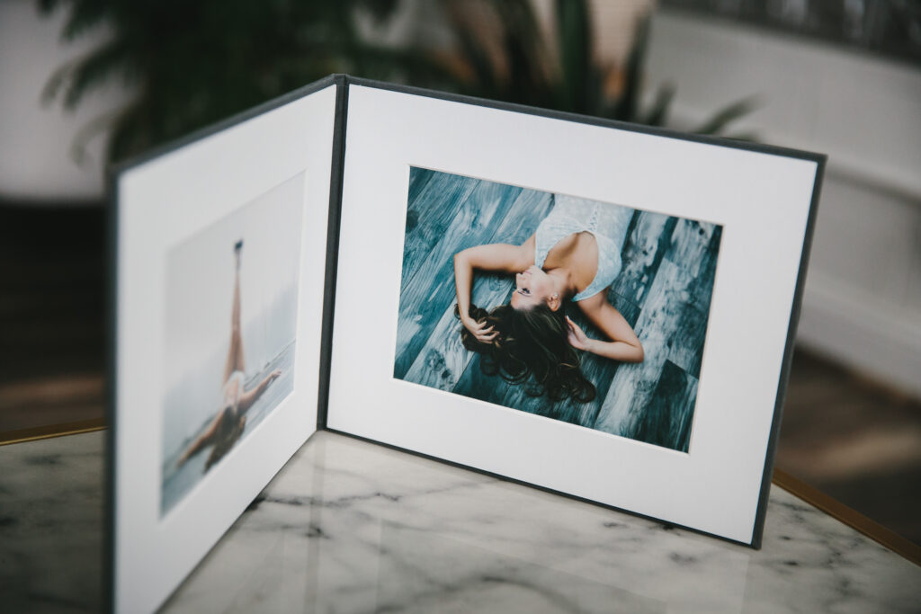 Two-panel matted print folio of boudoir images; by Lindsay Hite
