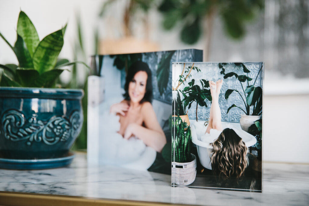 Two Crystal blocks on a marble table with images of boudoir photography by Lindsay Hite of Show Your Spark. 