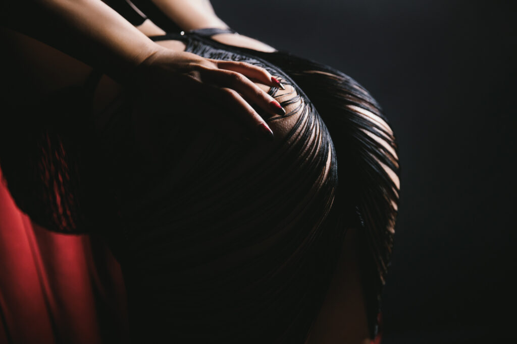 Image of a woman's booty in a fringe dress.  Boudoir photography by Lindsay Hite. 