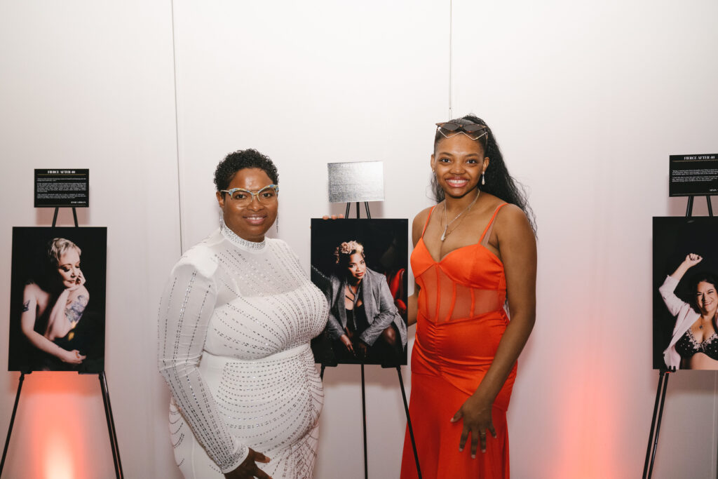 Picture of a Fierce After Forty Project Participant with her photo from the Gallery Show