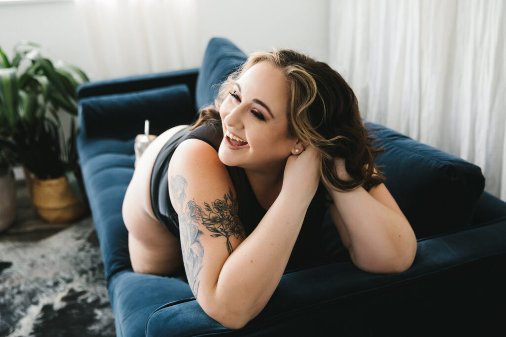 Woman normalizing grief while also embracing life poses for boudoir photography at Show Your Spark. Photography by Lindsay Hite. 